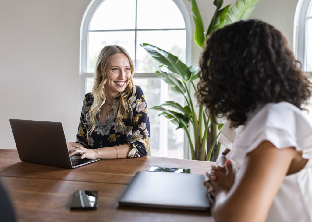 two women discussing business