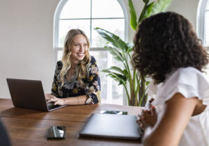 two women discussing business